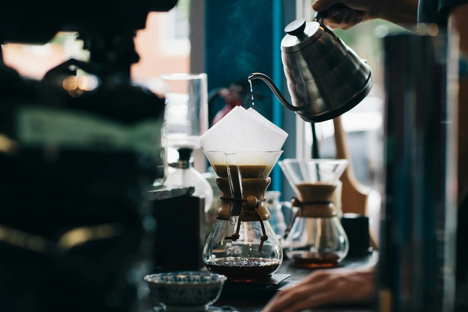 Pouring water over freshly ground coffee
